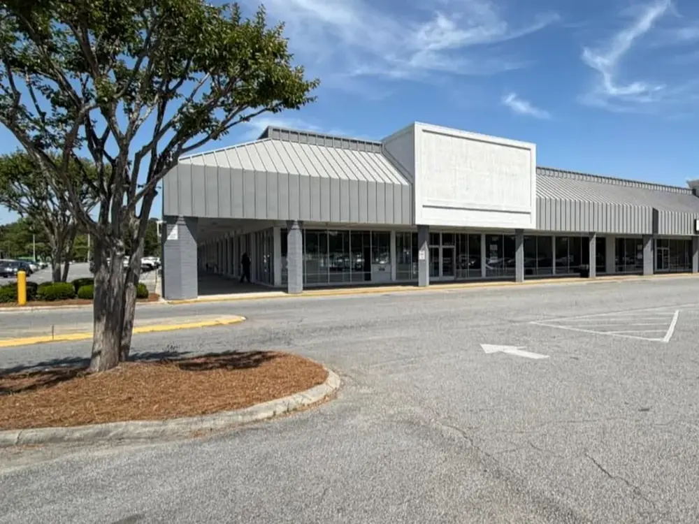 Actual exterior of the Antique Village Market building at Kinston Plaza