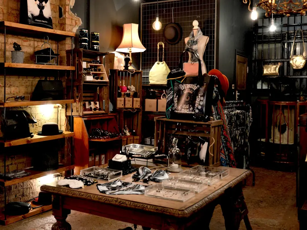 Professional vendor booth display with accessories, decor, lighting, and curated retail shelves