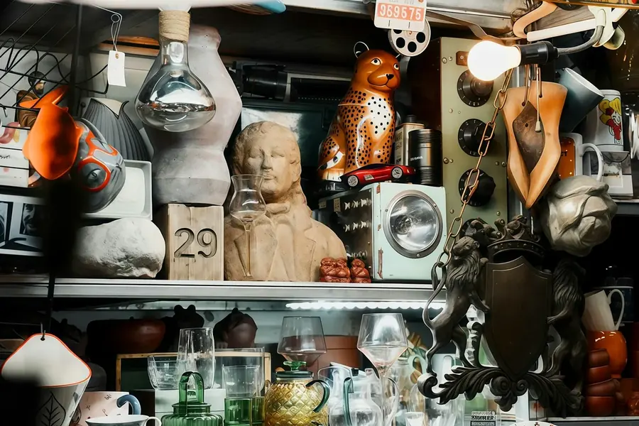 Decorative vintage display cabinet with framed art and home accents